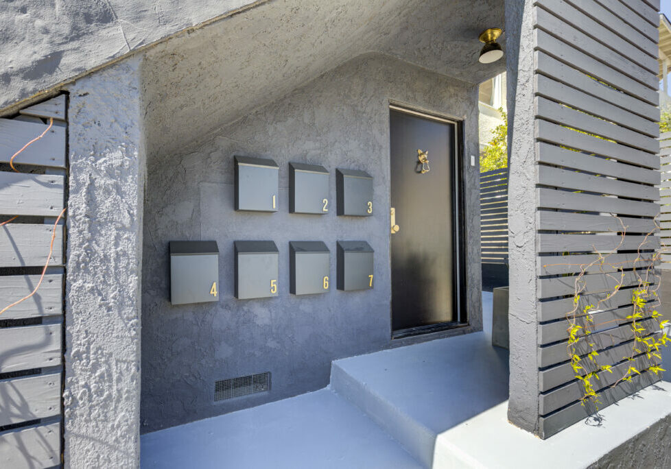 Exterior view of newly remodeled apartment complex unit and mailboxes